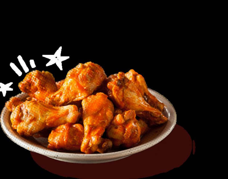 Glossy buffalo sauced wings on a ceramic plate